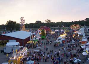 Aerial view of the midway, including Barn 4, rides, and vendors