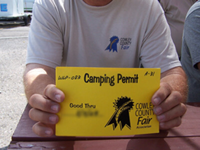Man holding camping permit