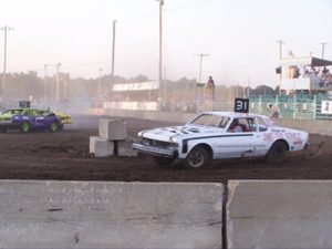 White figure 8 car driving around barrier